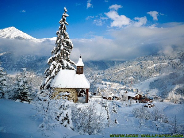 Small church around with the snow