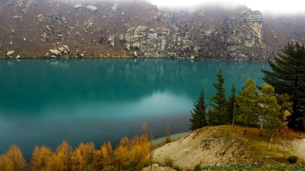 Blue lake in the fog