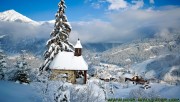 Small church around with the snow